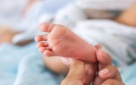 Baby foot being held-sm.jpg