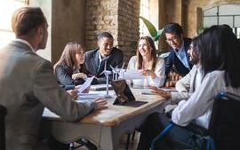 Group of multiethnic businesspeople working on sustainable innovation project.jpg